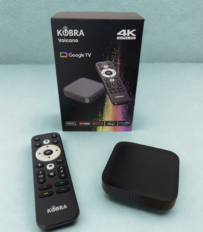 Kobra Volcano 4K Google TV device with remote control and packaging on a light blue background